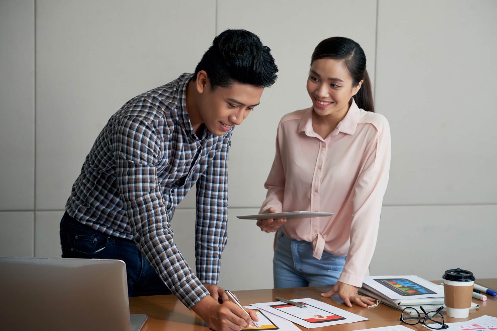 two people collaborating on a mobile app