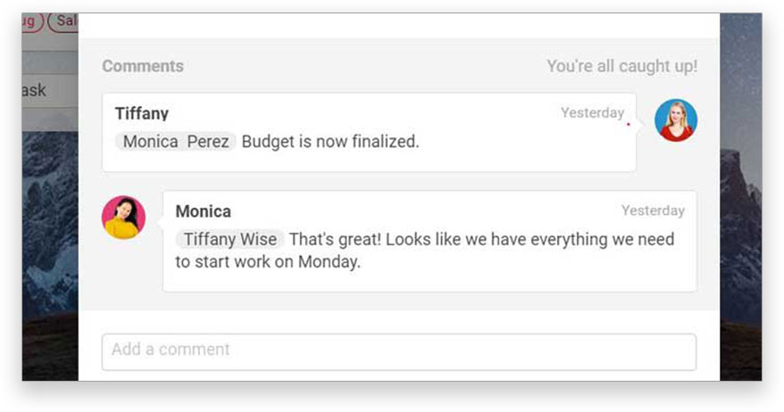A screenshot of ProjectManager.com’s task view, showing team members collaborating through comments